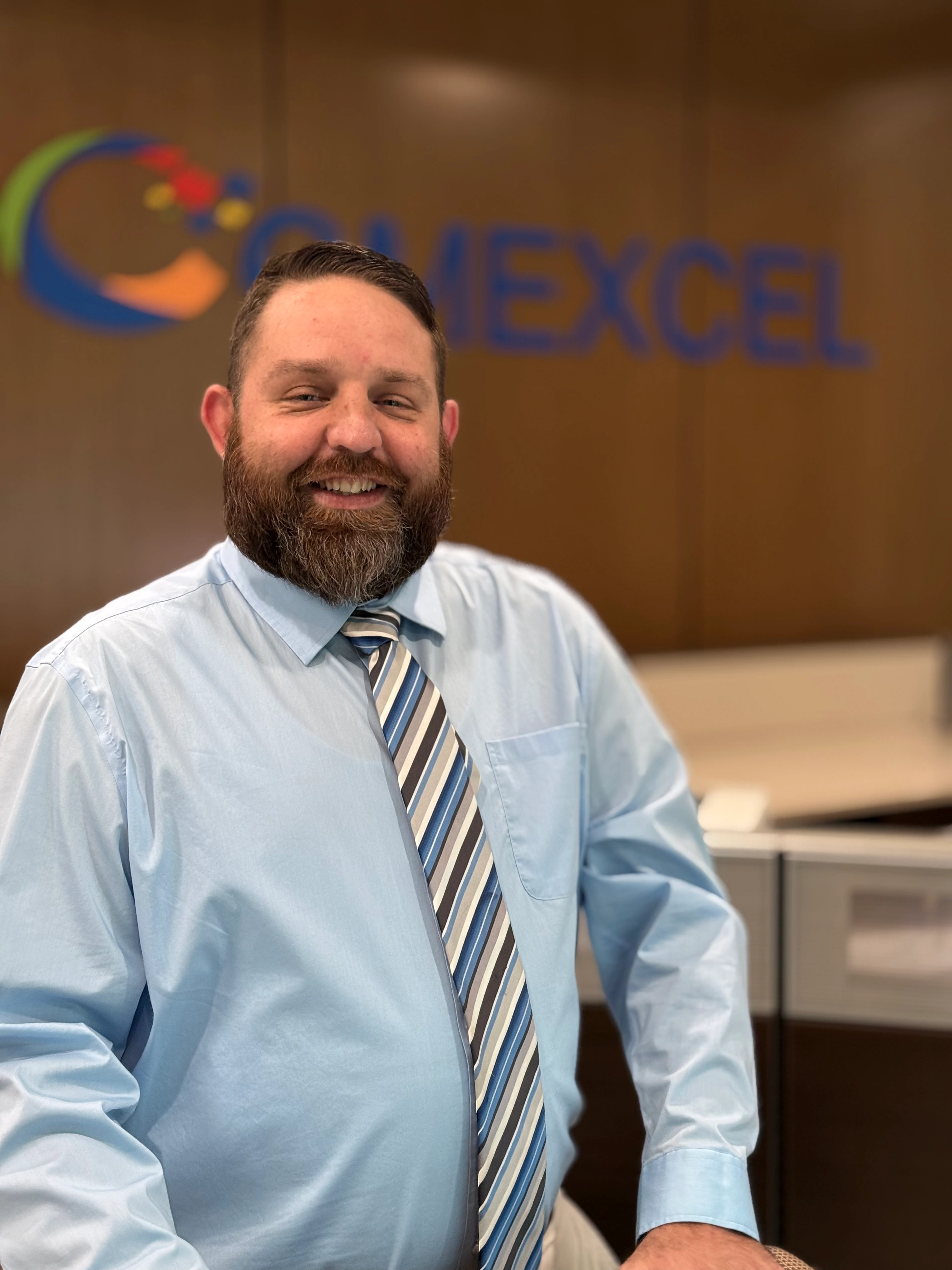 Comexcel’s local salesperson smiling at the office